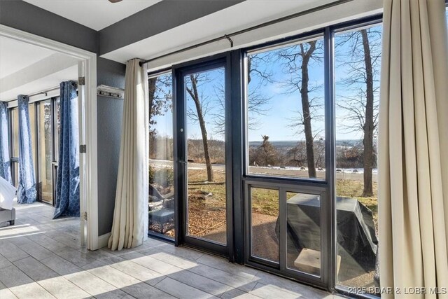 doorway to outside with light hardwood / wood-style flooring