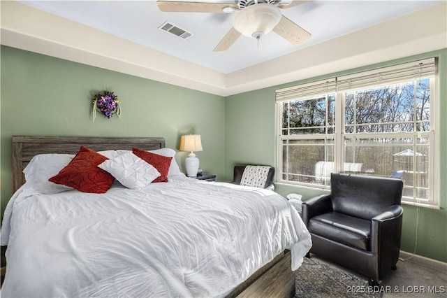 carpeted bedroom with ceiling fan