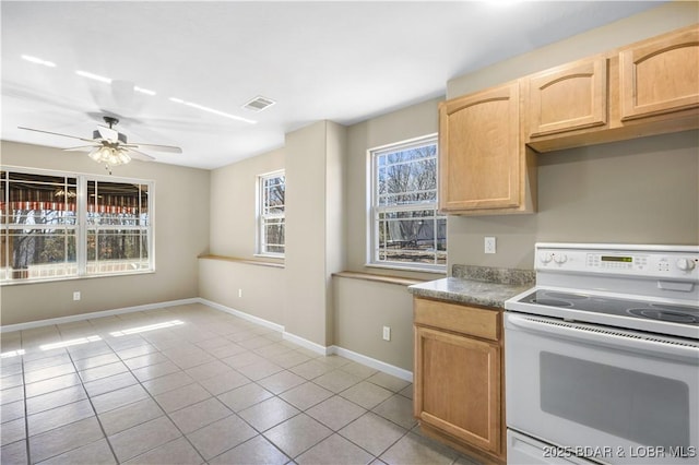 kitchen featuring ceiling fan, white range with electric stovetop, light tile patterned floors, and light brown cabinetry