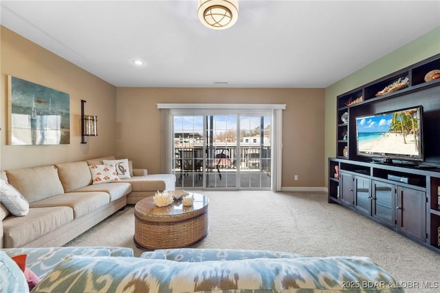 carpeted living room featuring built in features