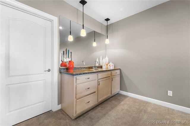 bar with sink, decorative light fixtures, light brown cabinetry, and light carpet