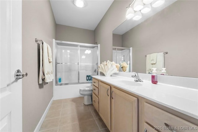 full bathroom with vanity, shower / bath combination with glass door, toilet, and tile patterned flooring