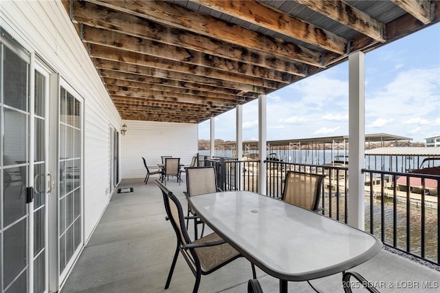 view of patio / terrace featuring a water view and french doors