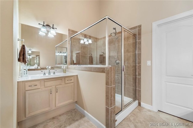 bathroom featuring a shower with shower door, tile patterned floors, and vanity