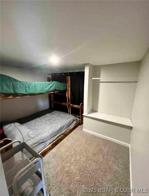 unfurnished bedroom with carpet floors