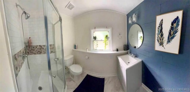 bathroom featuring toilet, walk in shower, lofted ceiling, and vanity