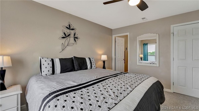 bedroom with light carpet and ceiling fan