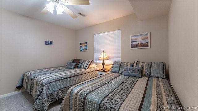 bedroom with ceiling fan and carpet flooring