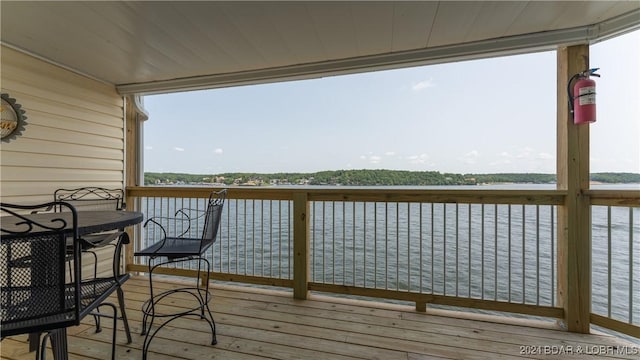 wooden deck with a water view