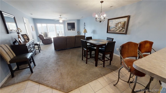 tiled dining space with ceiling fan