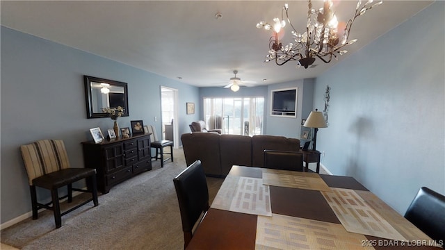 dining room with carpet and ceiling fan