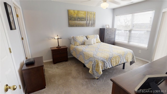 bedroom featuring ceiling fan and light colored carpet