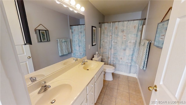 full bathroom featuring toilet, tile patterned floors, shower / bathtub combination with curtain, and vanity