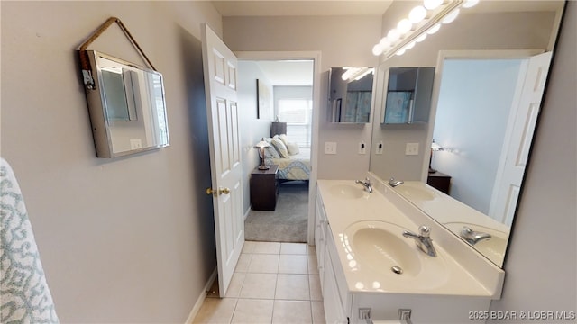 bathroom with tile patterned flooring and vanity