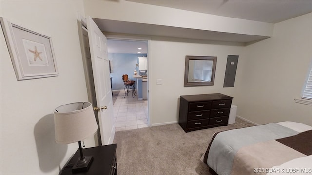 bedroom featuring light colored carpet and electric panel