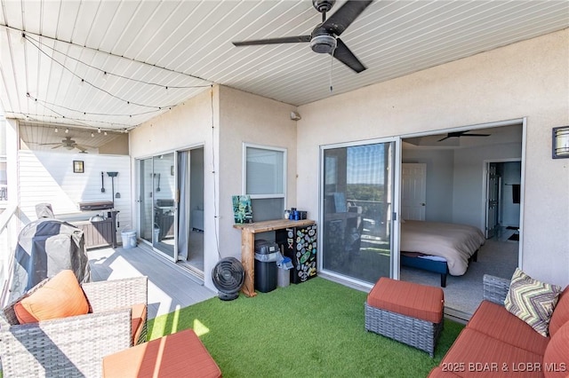 view of patio with an outdoor living space and ceiling fan