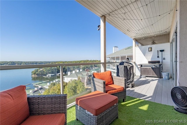 balcony featuring a water view