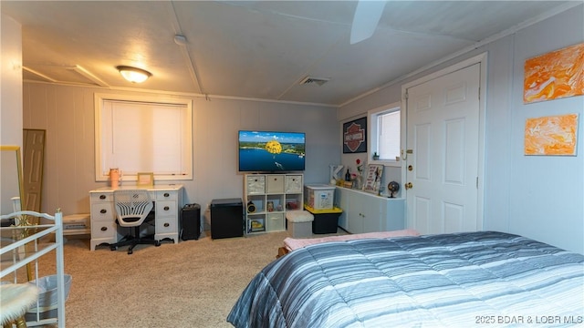 bedroom with crown molding, a closet, and carpet flooring