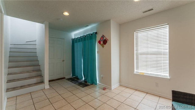 interior space featuring a textured ceiling