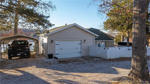 exterior space featuring a carport and a garage