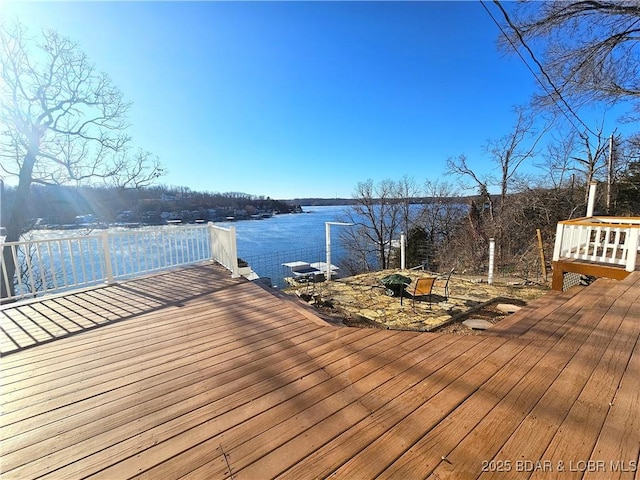 dock area featuring a deck with water view