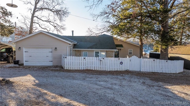 ranch-style house featuring a garage