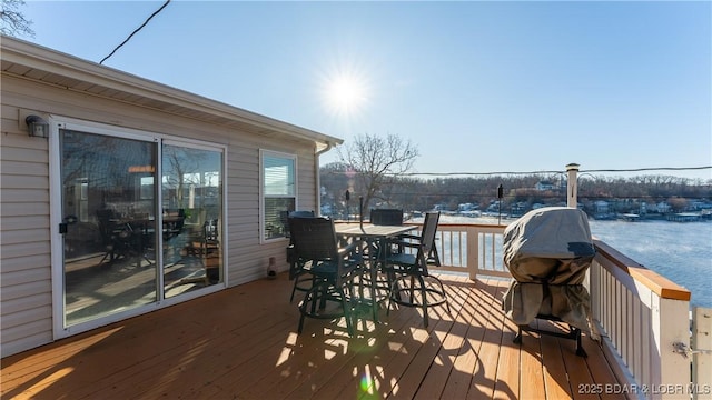 wooden deck with a water view