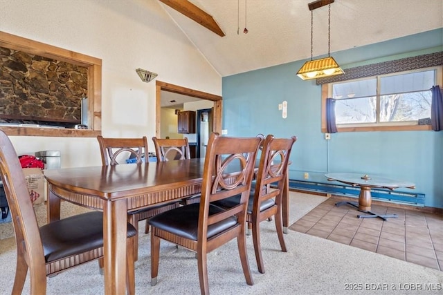 tiled dining space featuring high vaulted ceiling and beam ceiling