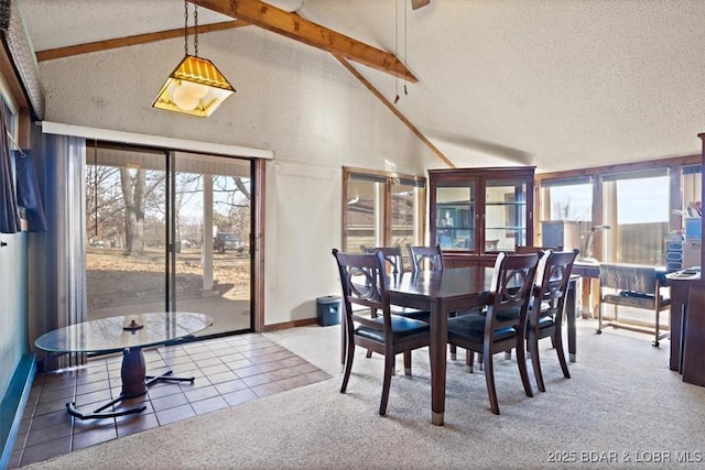 carpeted dining space featuring beam ceiling, a textured ceiling, and high vaulted ceiling