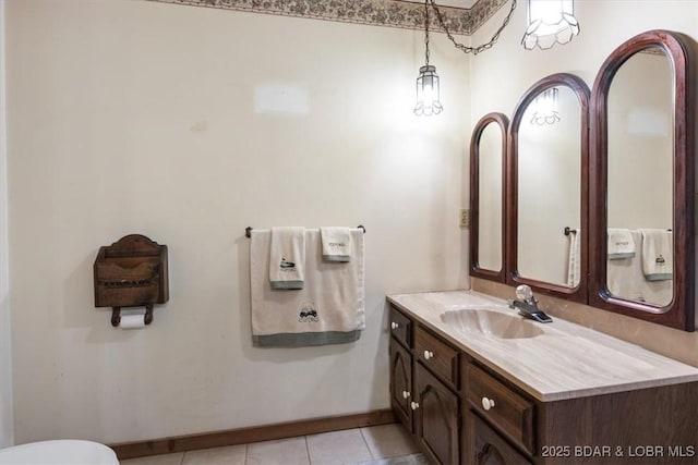 bathroom featuring tile patterned flooring and vanity