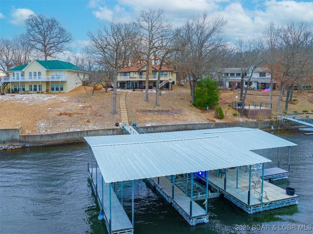 dock area featuring a water view and boat lift