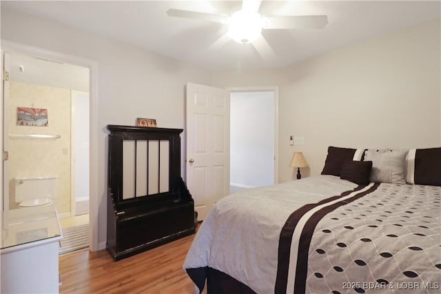 bedroom with hardwood / wood-style flooring and ceiling fan