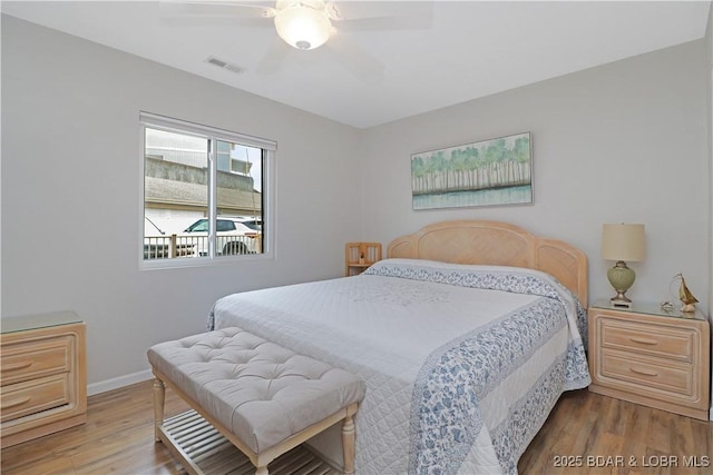 bedroom featuring ceiling fan and hardwood / wood-style floors