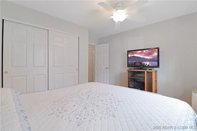 bedroom with ceiling fan and a closet