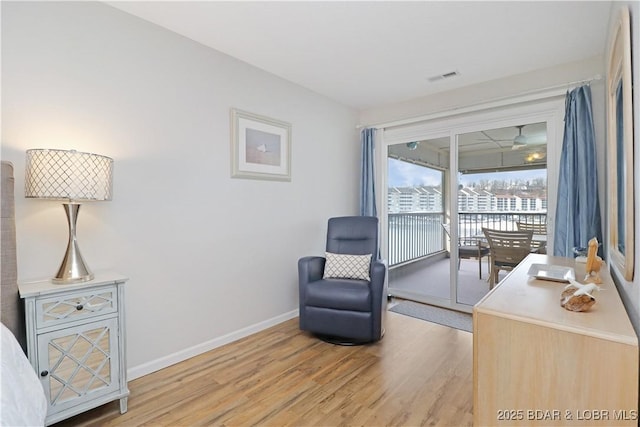 sitting room with light wood-type flooring