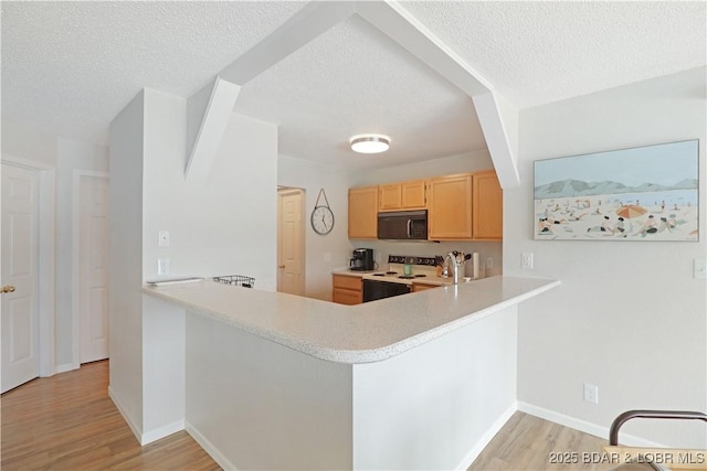 kitchen featuring white electric range, light wood-type flooring, kitchen peninsula, light brown cabinets, and a textured ceiling