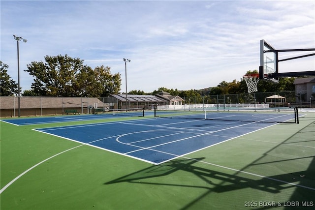 view of tennis court with basketball court