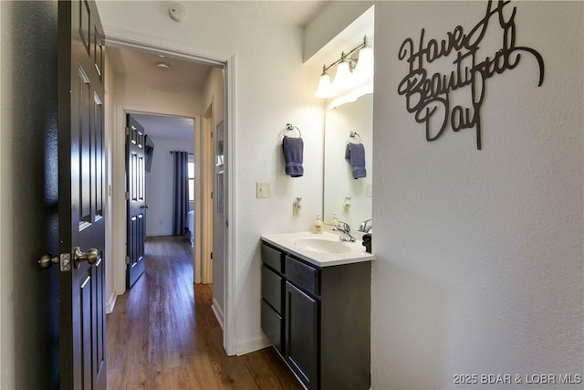 bathroom with vanity and wood-type flooring