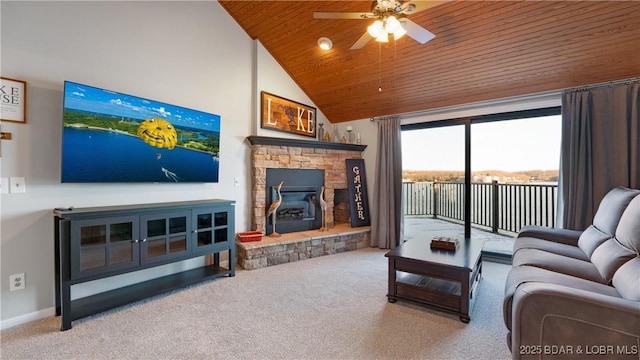 living room featuring lofted ceiling, ceiling fan, light carpet, a stone fireplace, and wooden ceiling