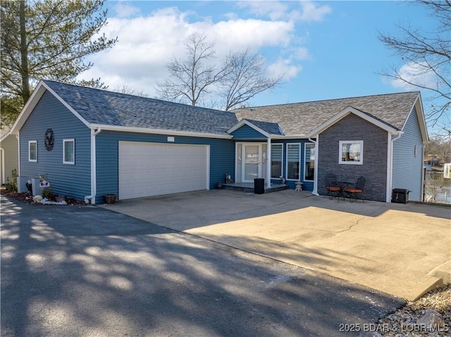 ranch-style home with a garage