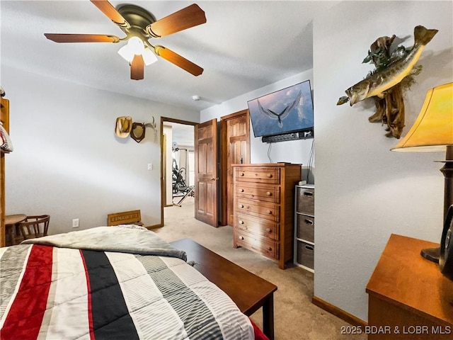 bedroom with light colored carpet and ceiling fan