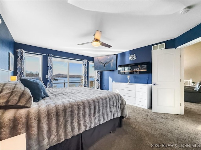 bedroom featuring ceiling fan, access to exterior, and carpet floors