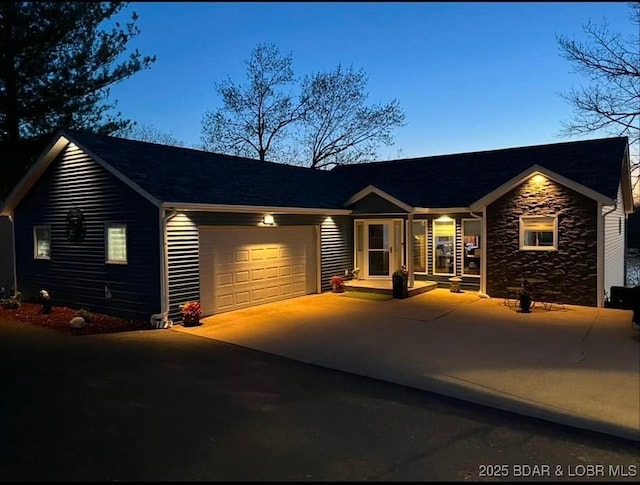 single story home featuring a garage