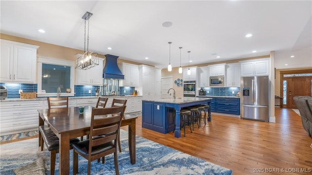 dining room featuring light hardwood / wood-style flooring and sink