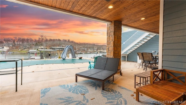 view of patio featuring a water view