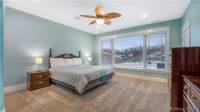 bedroom with light carpet and ceiling fan