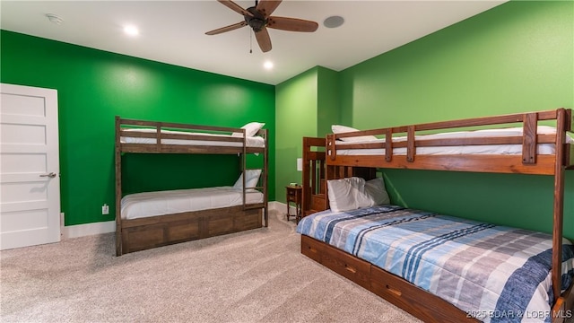 bedroom with ceiling fan and carpet flooring