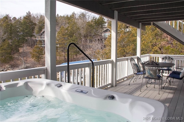 wooden terrace with a hot tub