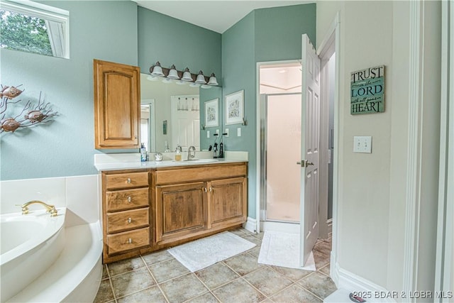 bathroom with vanity, plus walk in shower, and tile patterned flooring