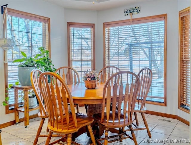 dining space featuring light tile patterned floors